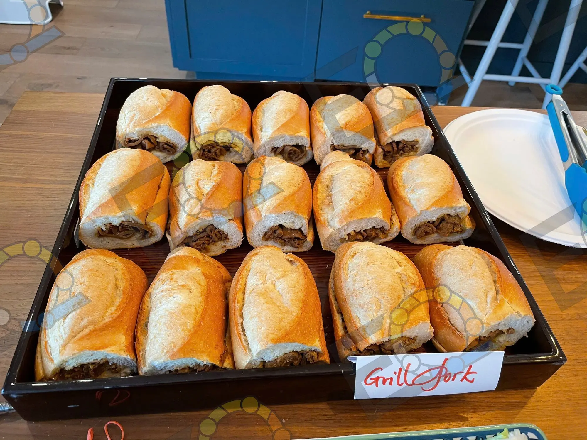 A tray of grilled pork banh mi ready for service