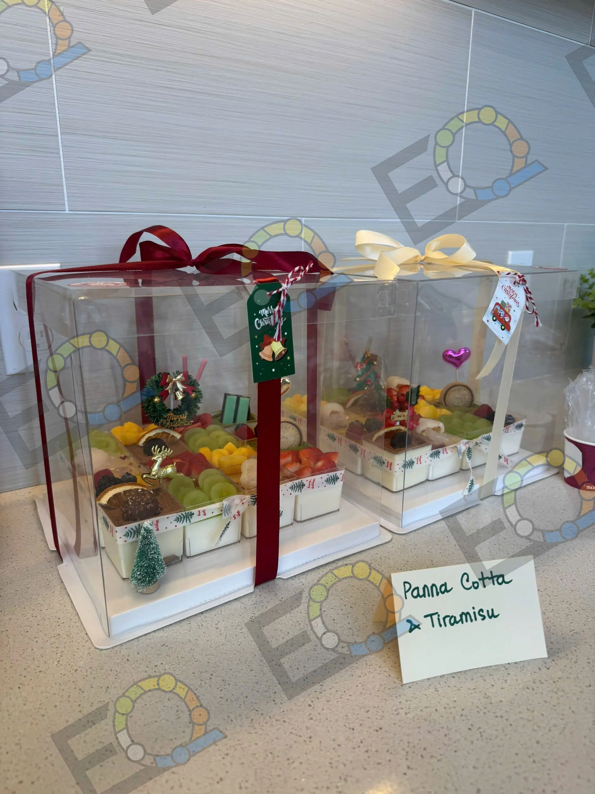 Panna cotta and tiramisu in clear gift boxes tied with ribbon