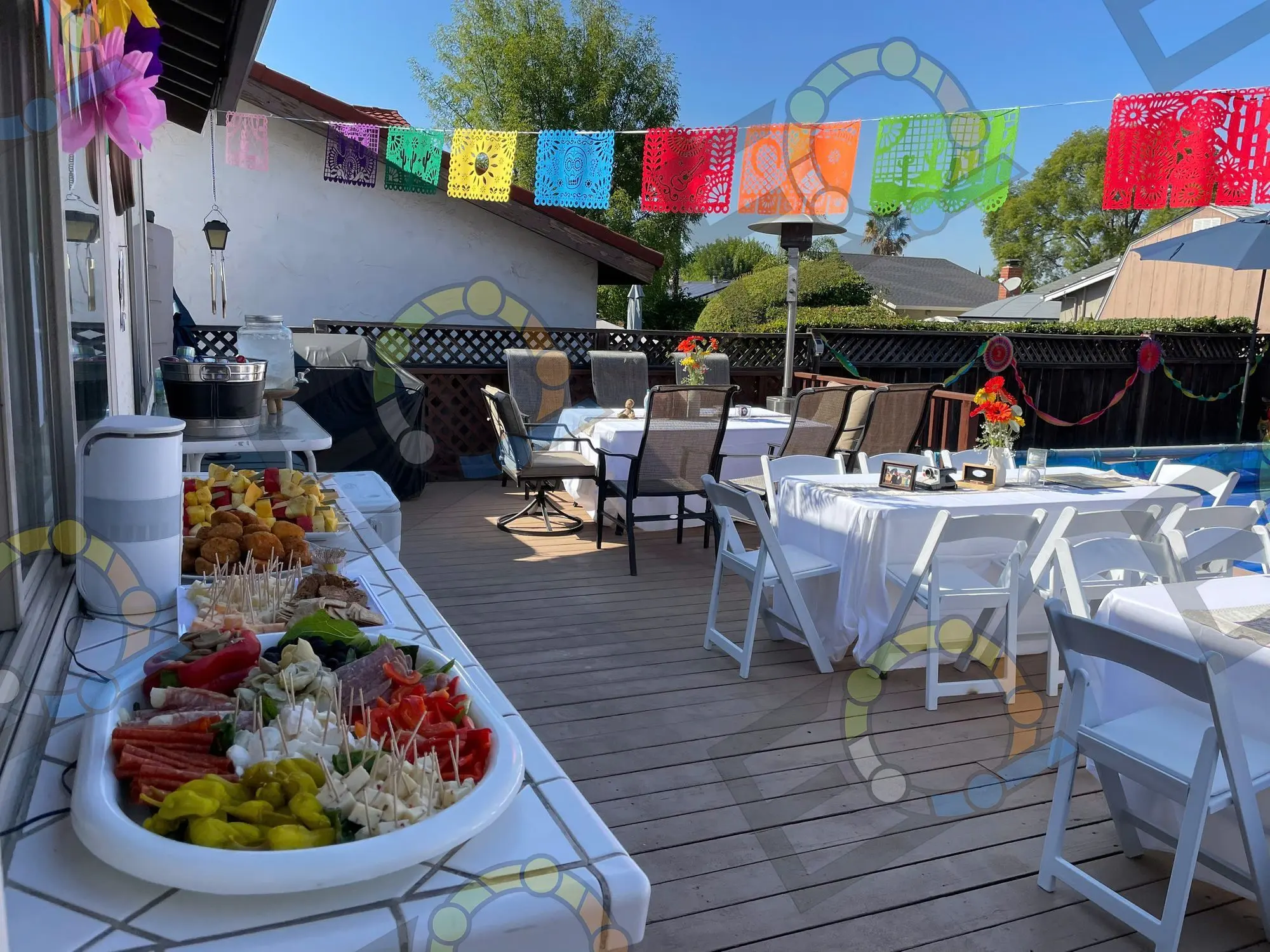 A deck buffet spread under colourful bunting