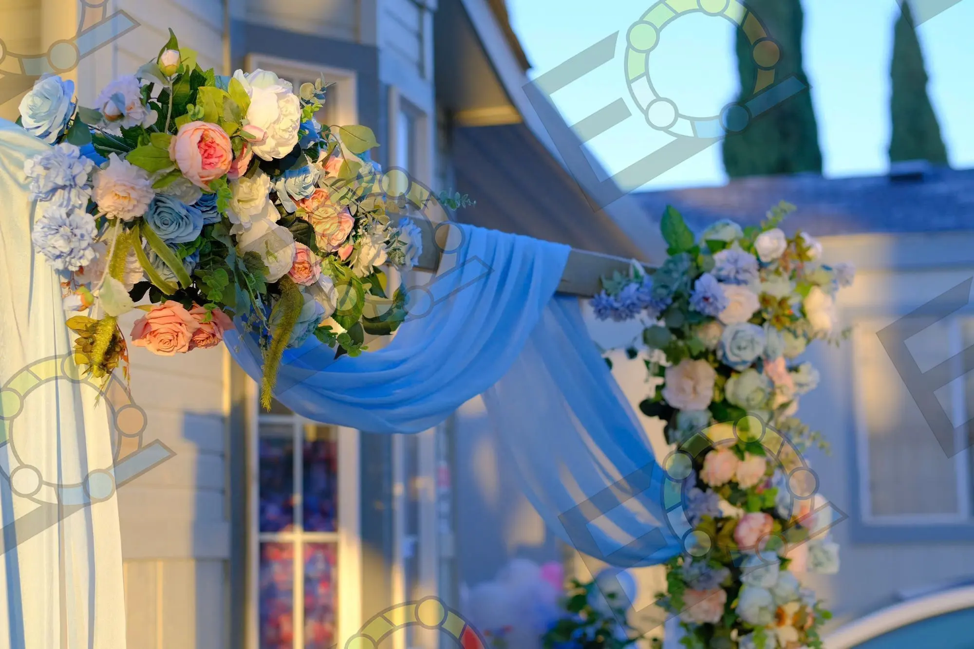Pastel florals and blue draping framing a doorway