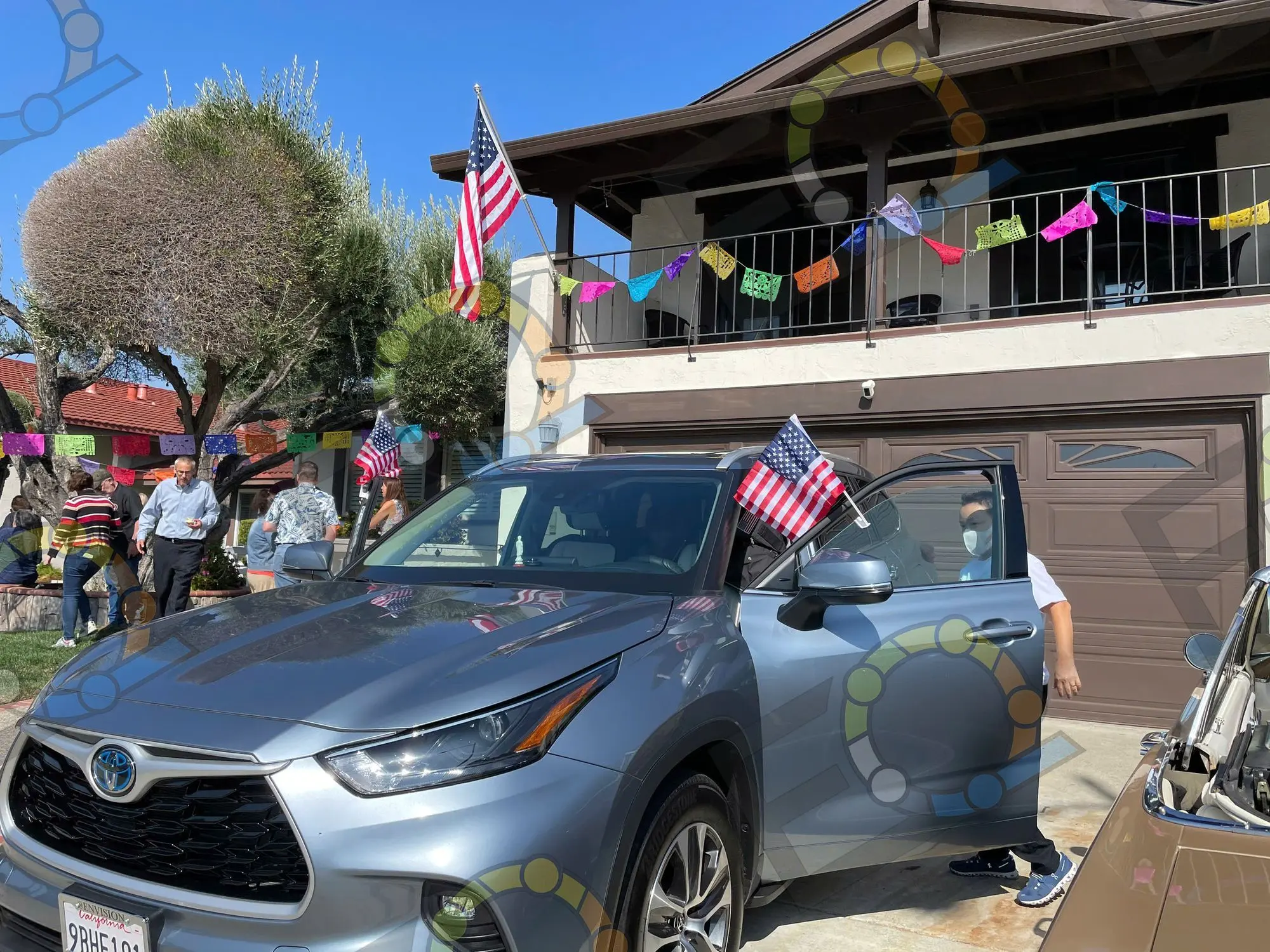 A car dressed with flags for a Fourth of July gathering
