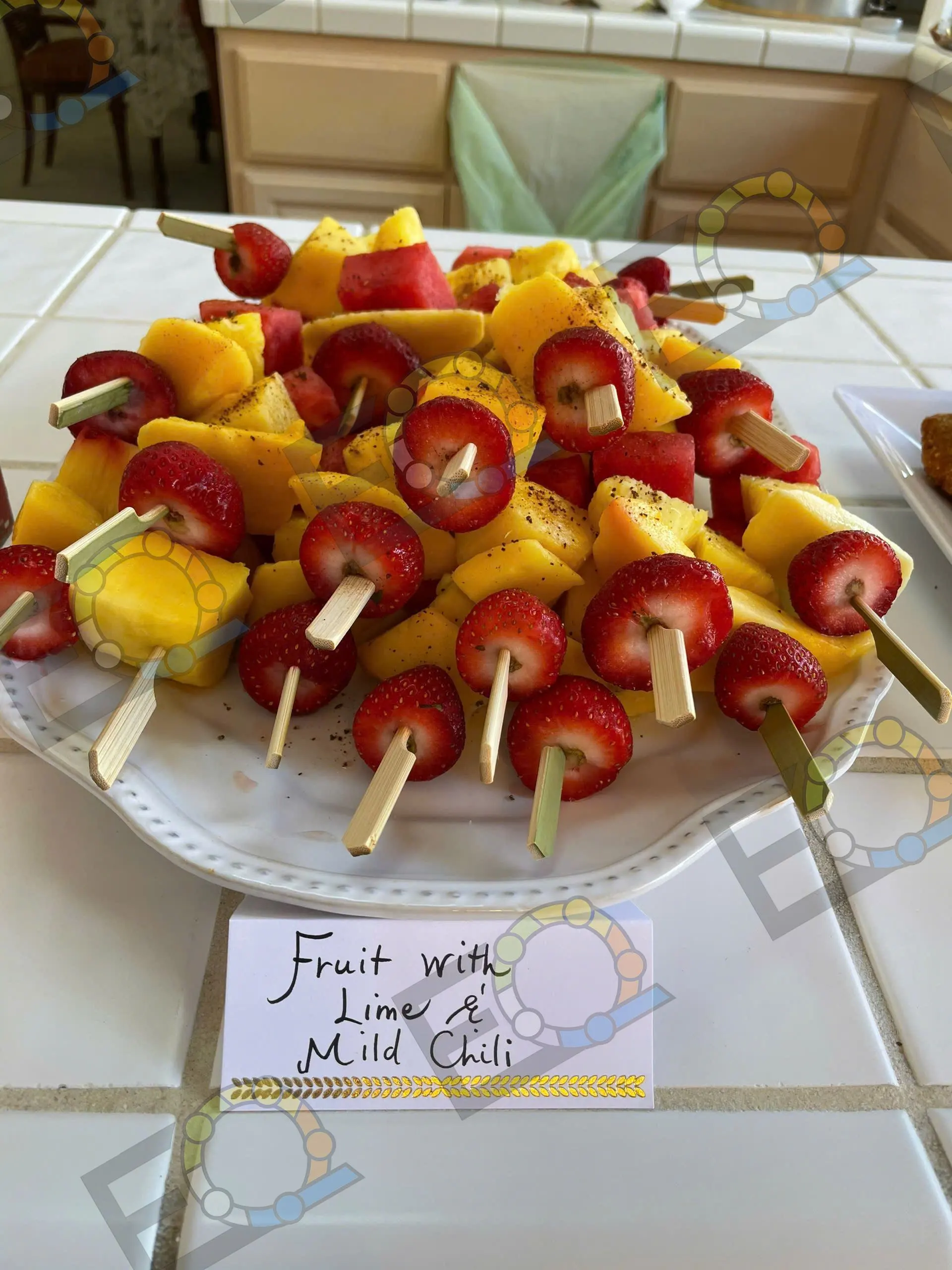 Fruit skewers served with lime and mild chilli