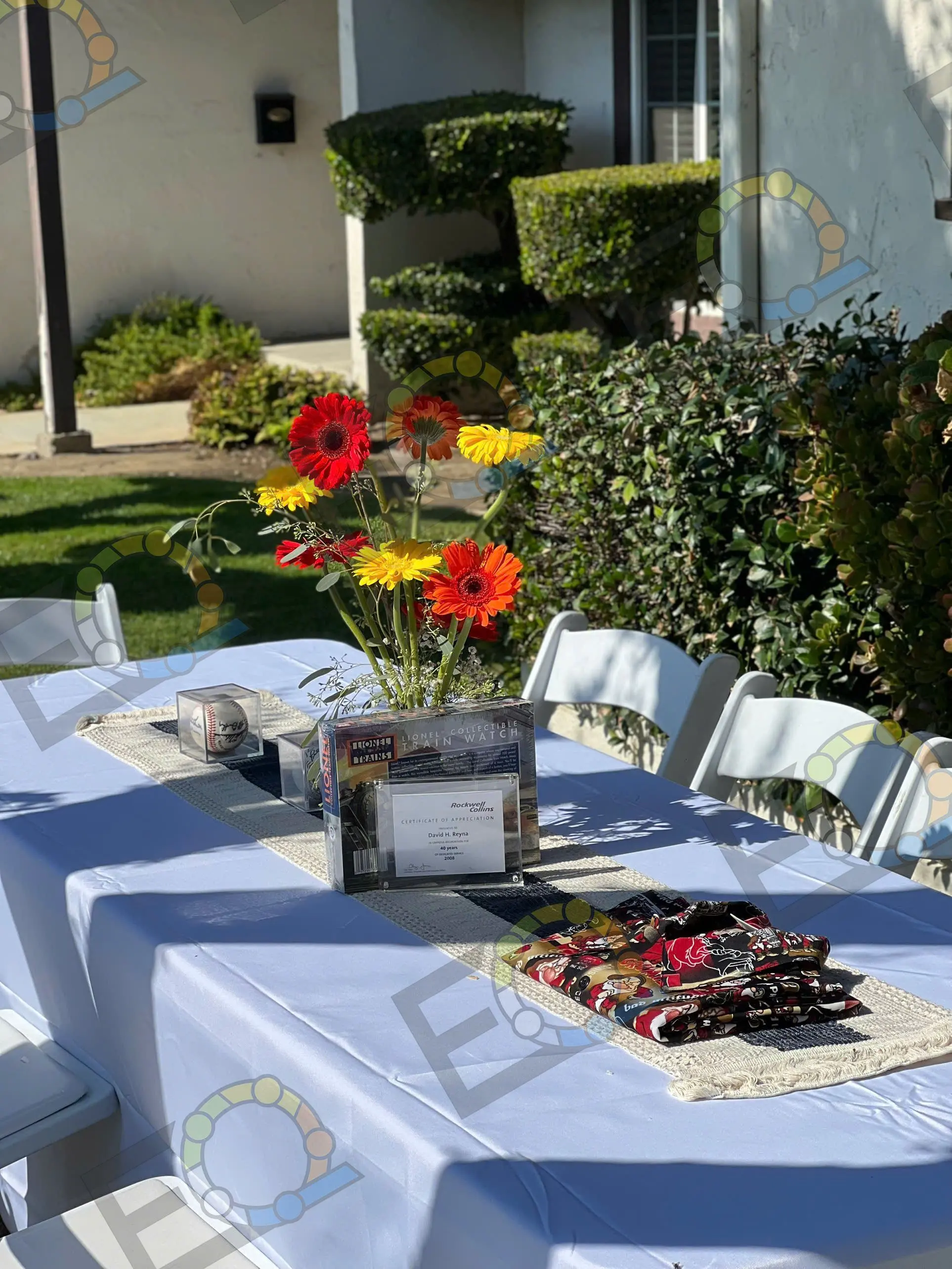 Sunflower and gerbera centrepieces on a garden banquet table