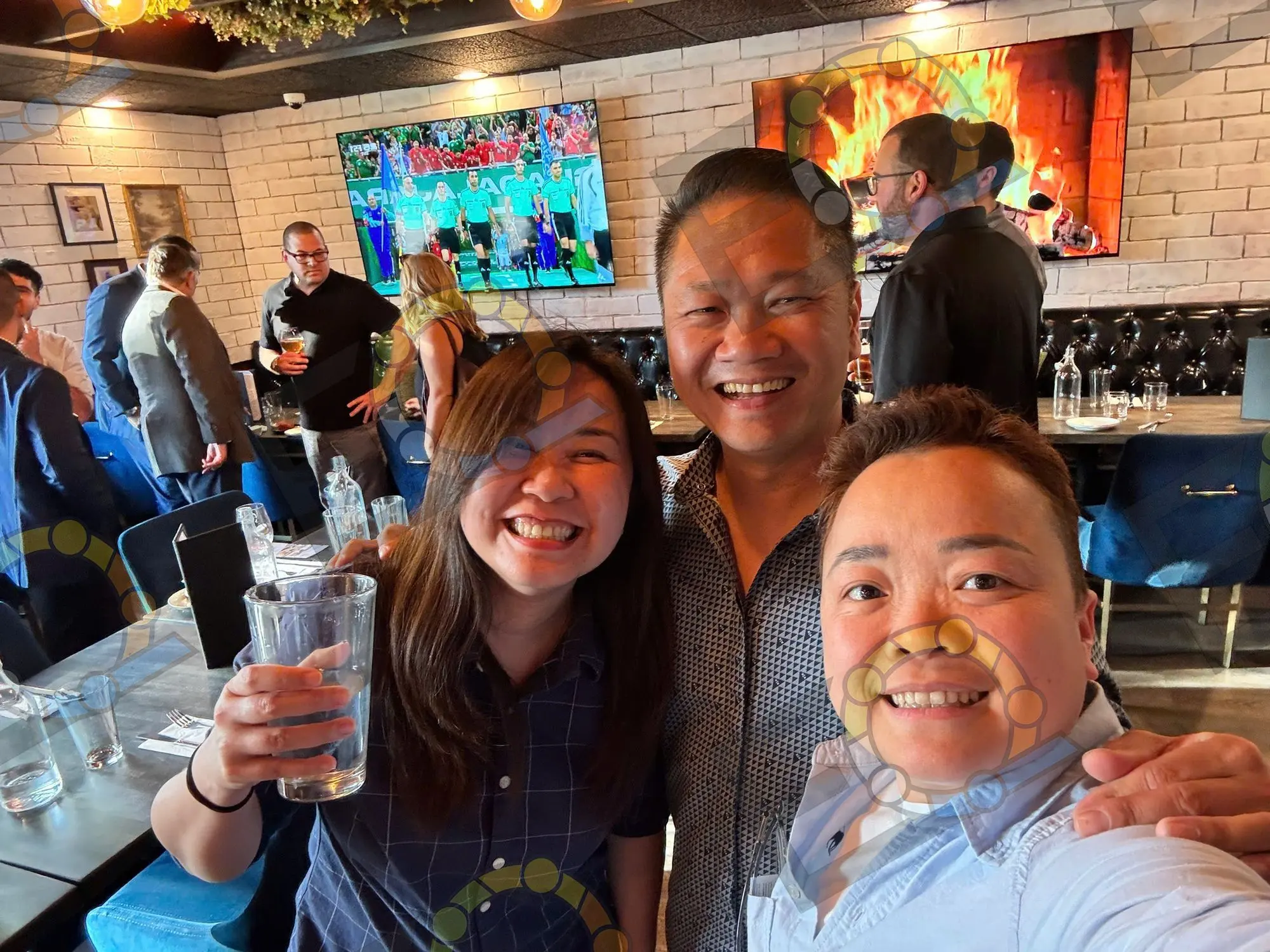 Guests raising their glasses at a celebration