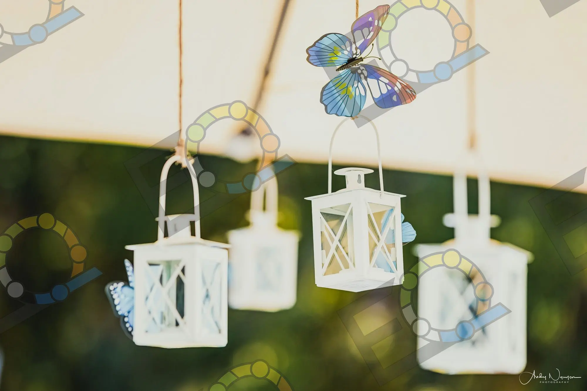 A row of white lanterns hung along a beam
