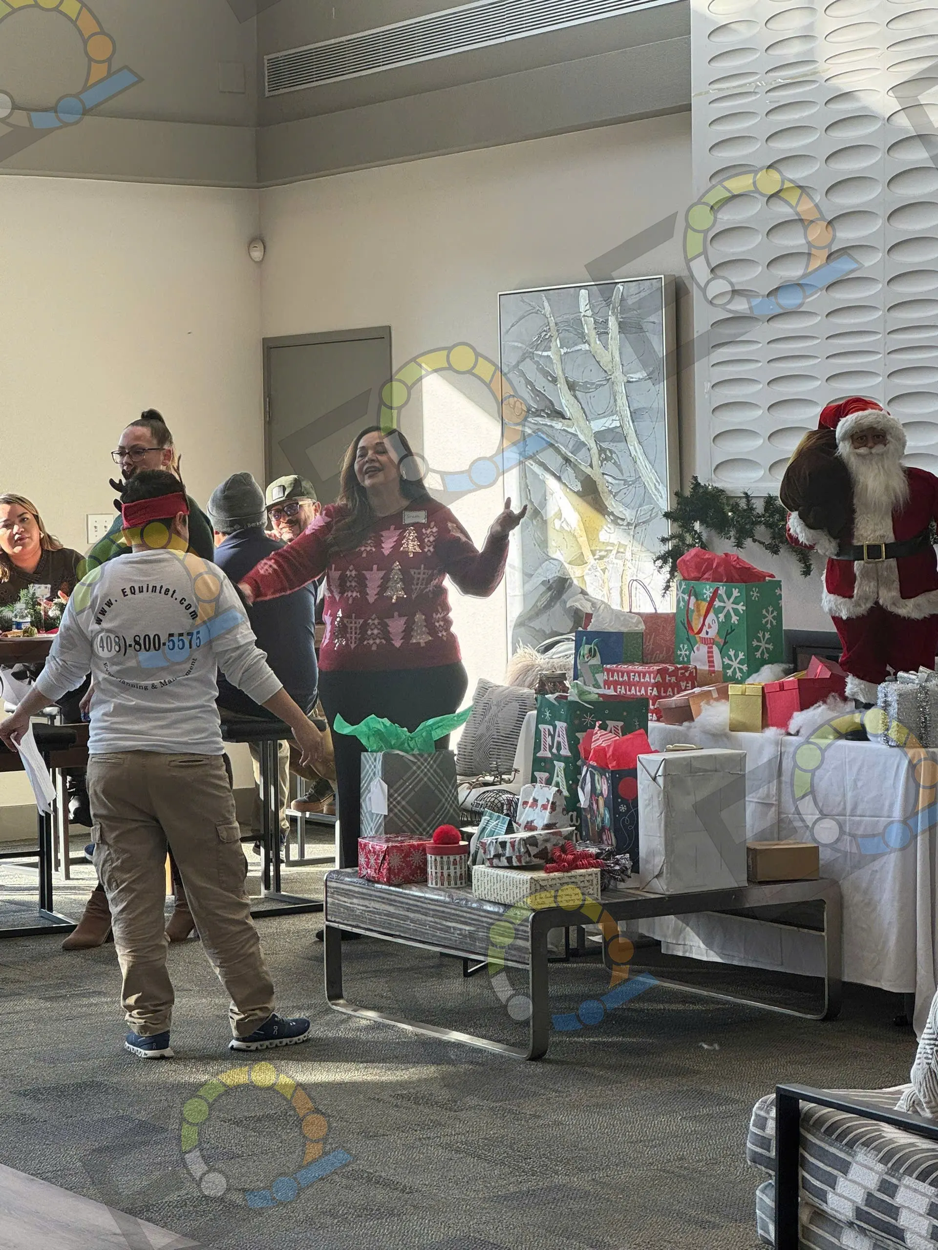Setting up a holiday party room with gifts and decorations