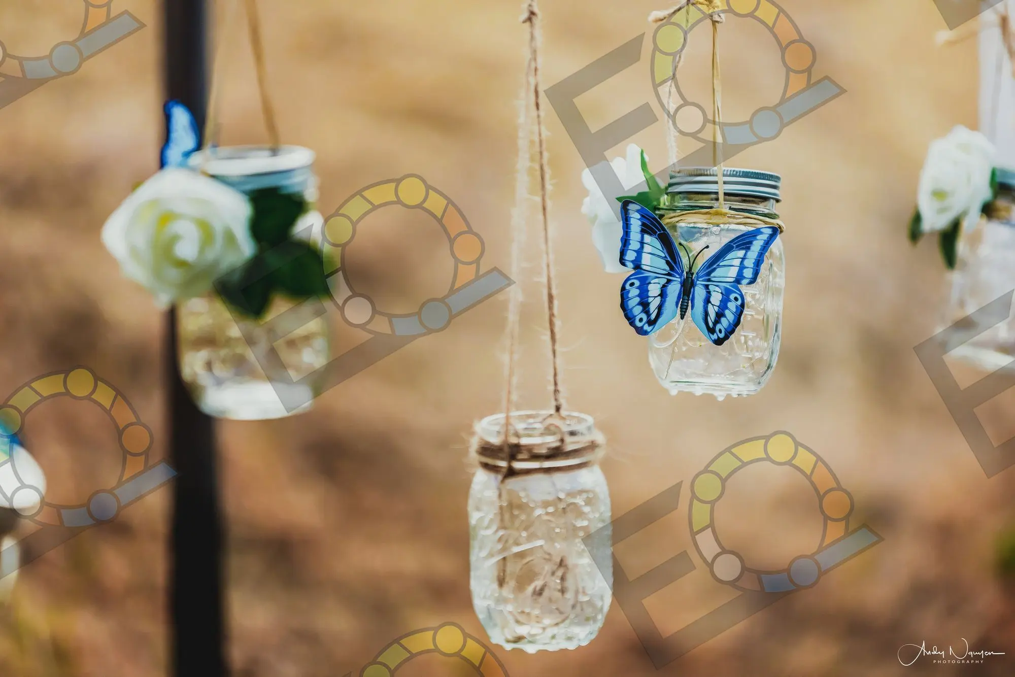 Mason jar lanterns strung at different heights