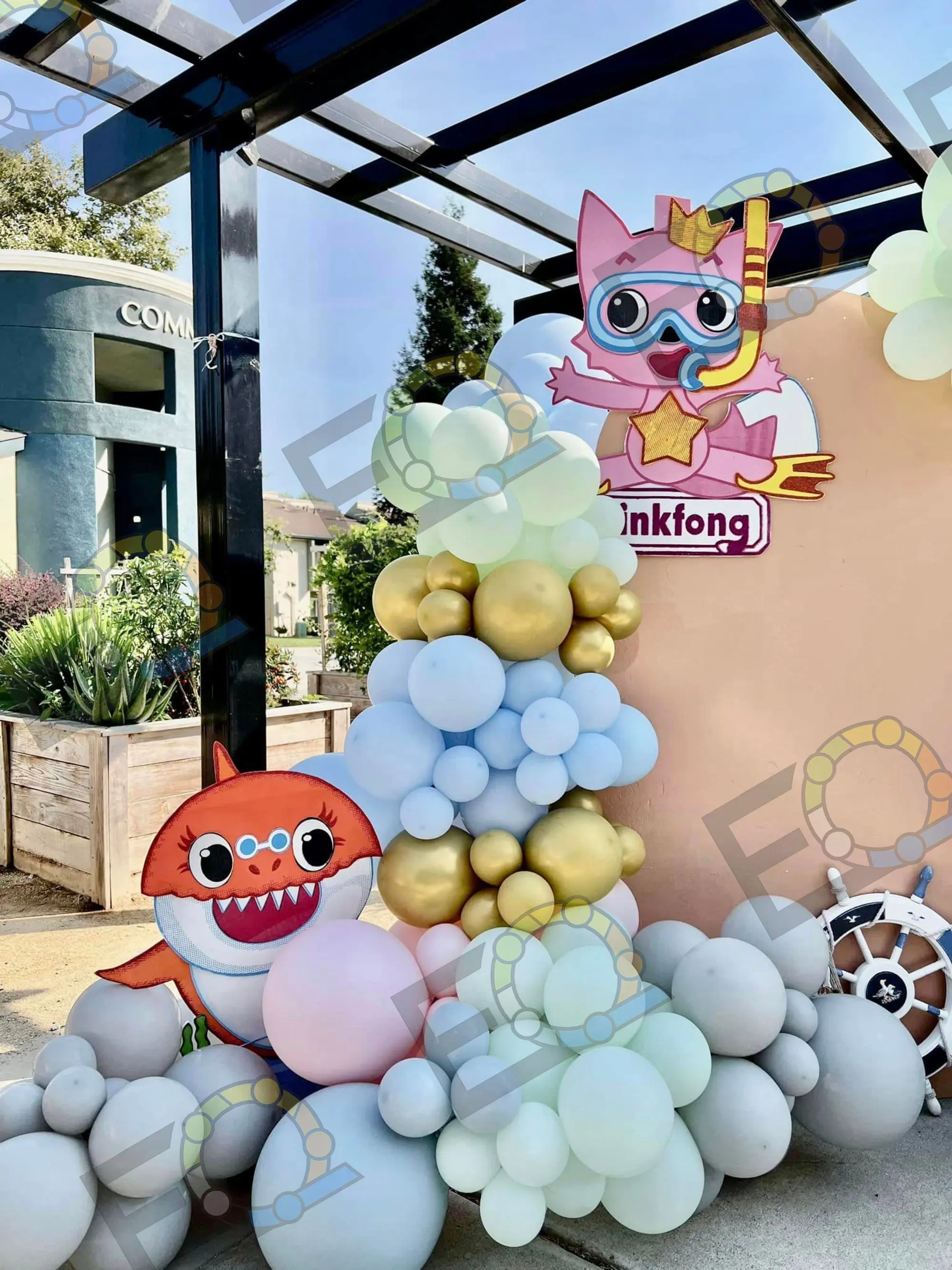 Pastel balloon arch with character cutouts