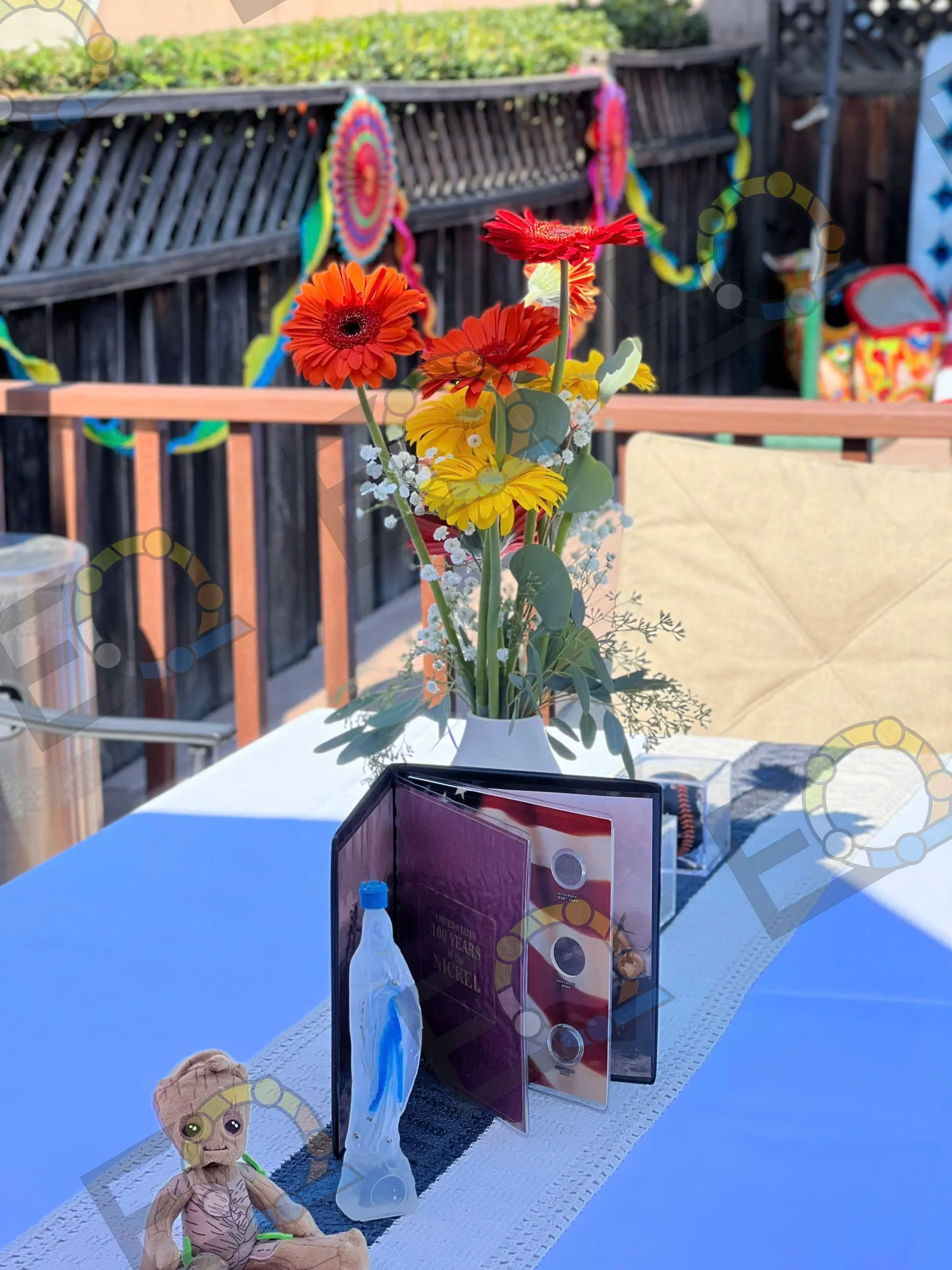A gerbera centrepiece on a poolside table