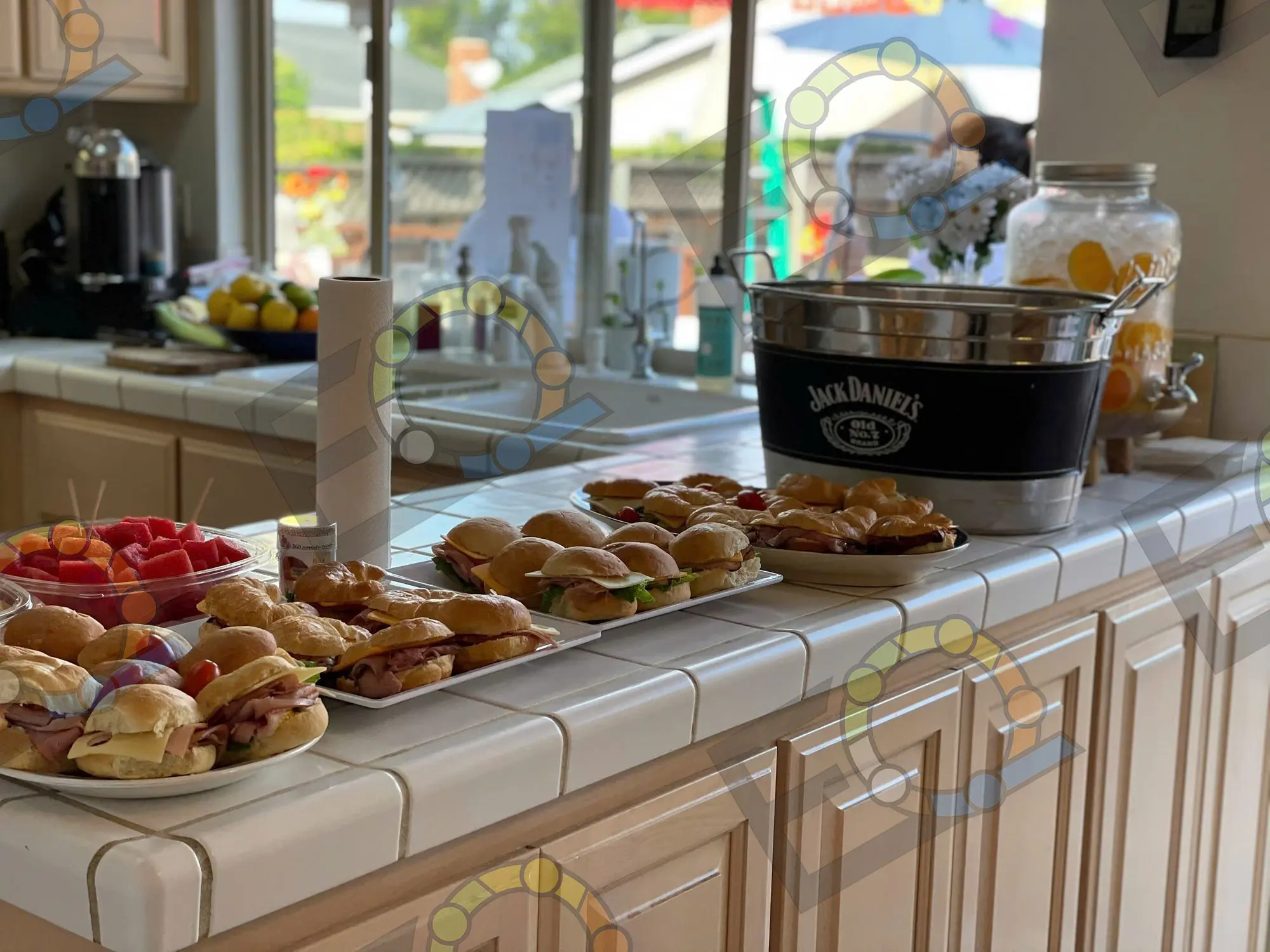 Sliders and drinks laid out along a kitchen counter