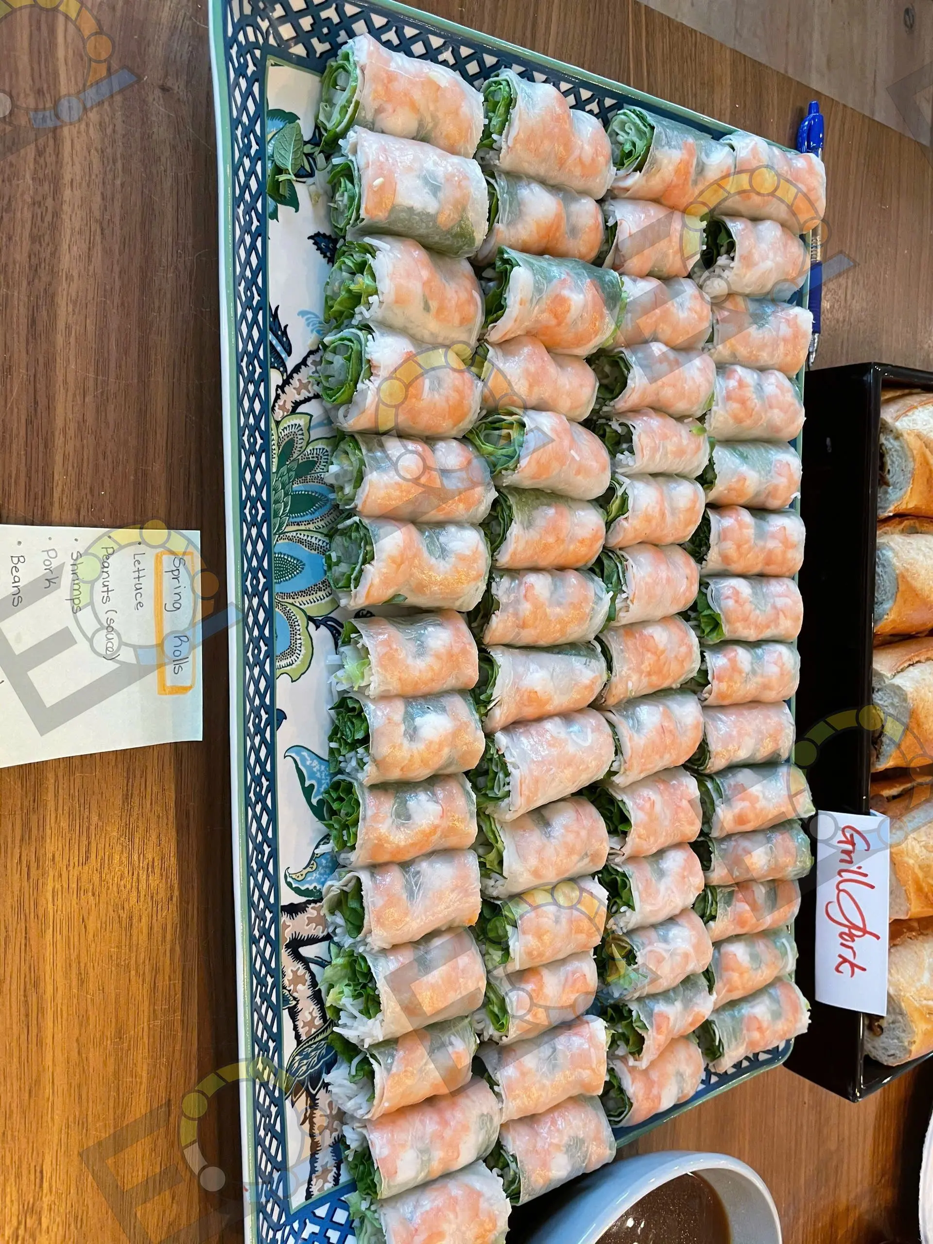 Rows of fresh spring rolls arranged for service