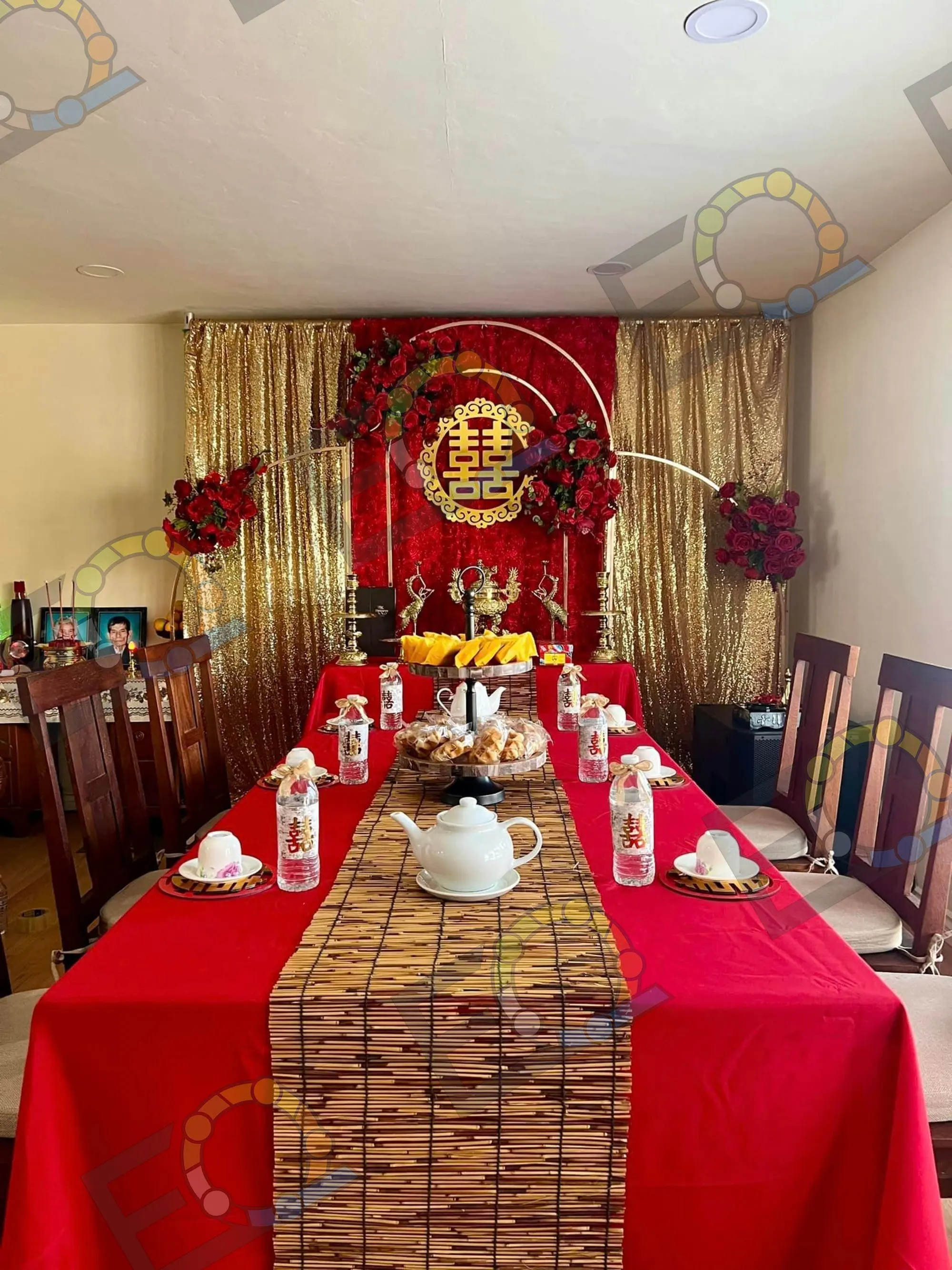 Tea ceremony table set with offerings and double happiness backdrop