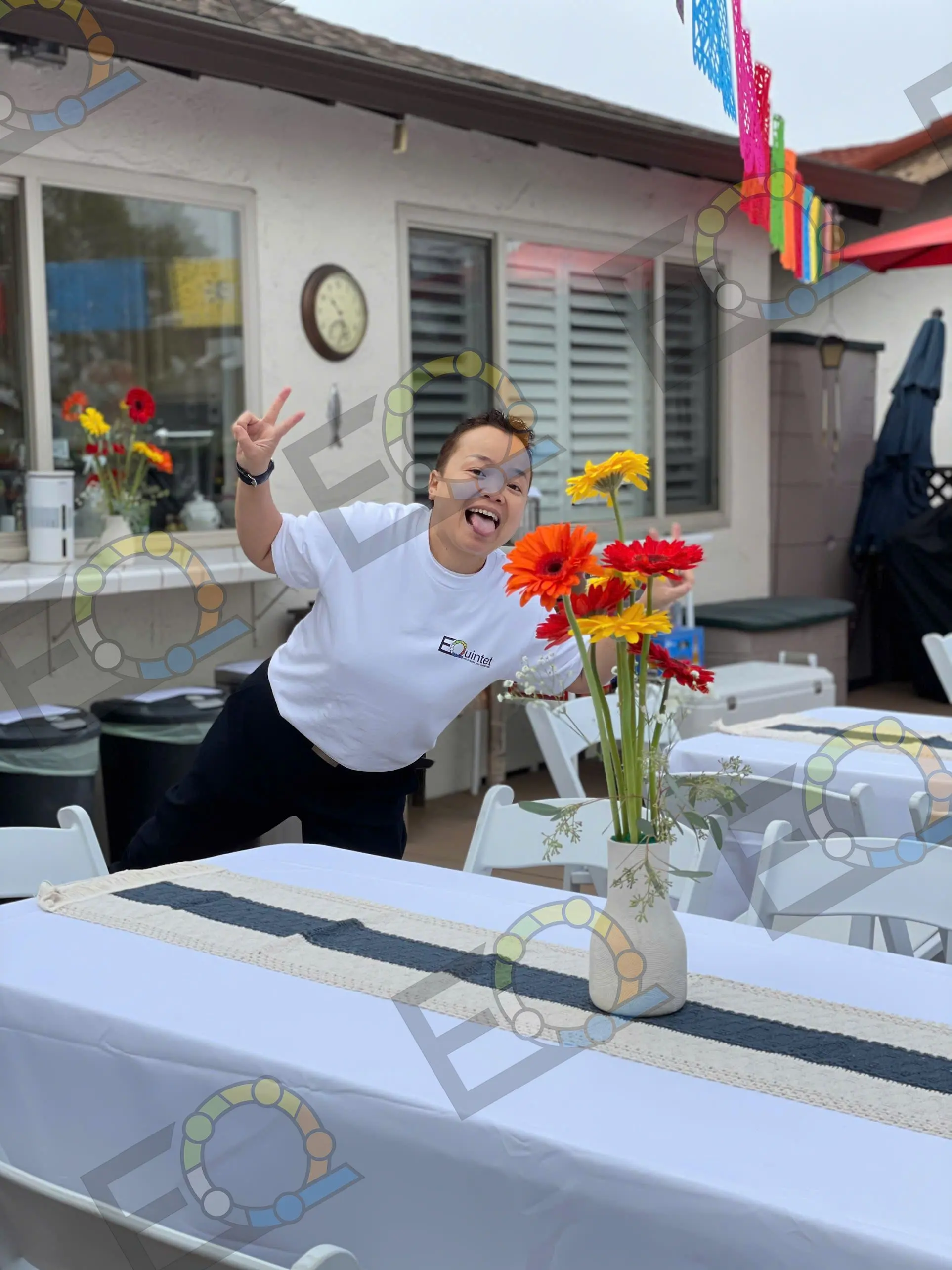 Setting fresh flowers on a table before guests arrive