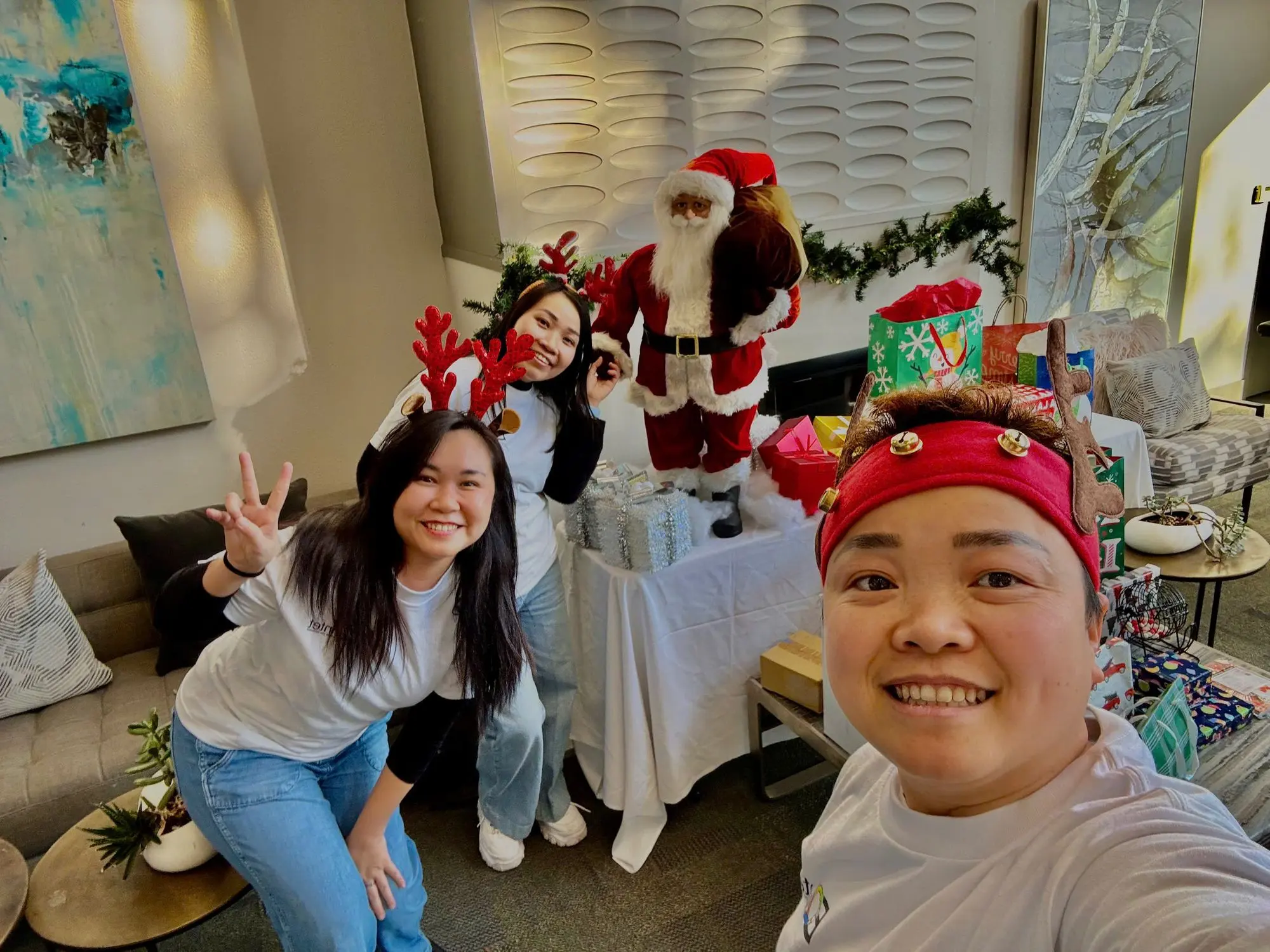 Three of the EQuintet team at a holiday party they set up