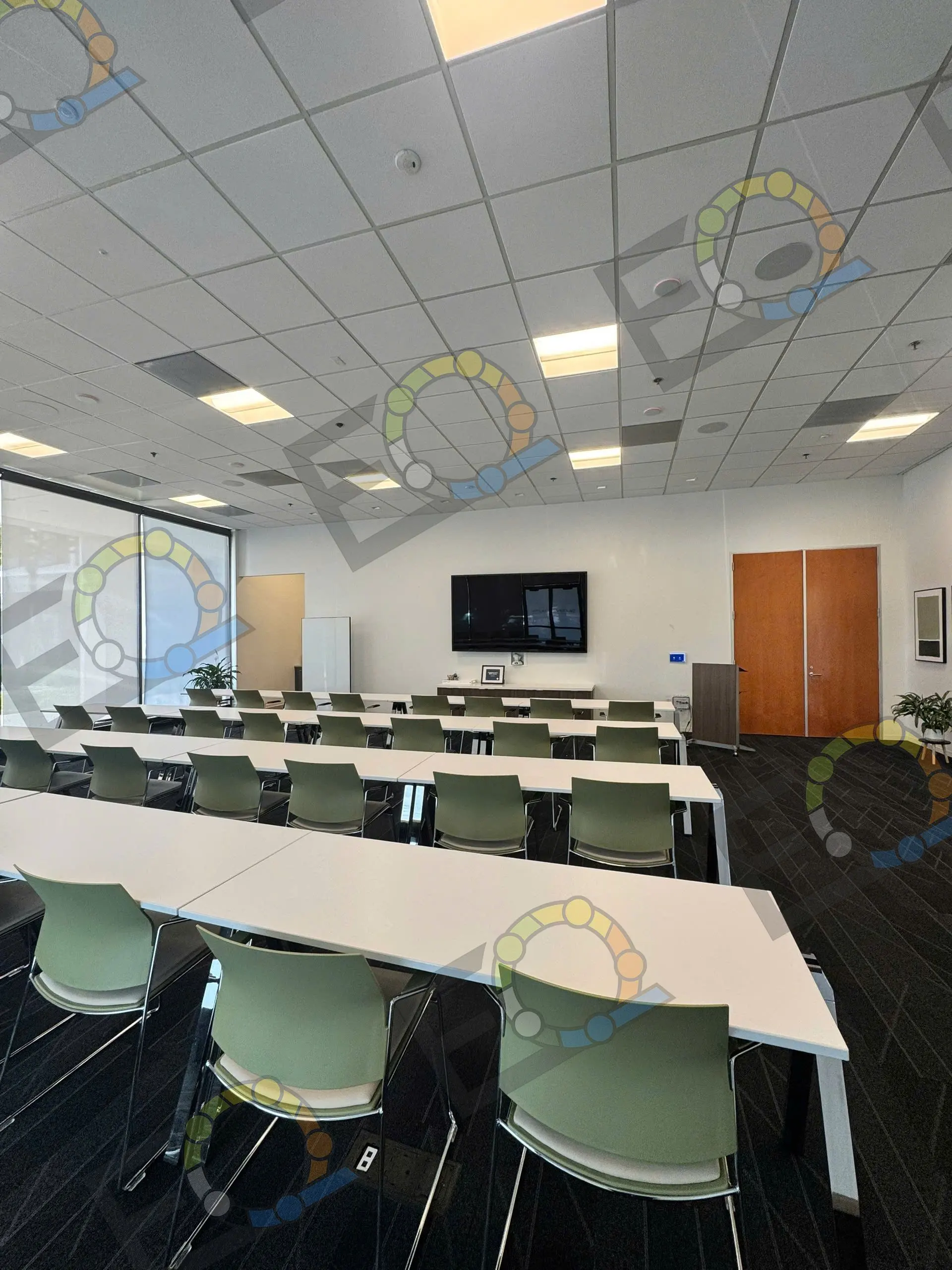 A training room set in rows, with daylight along one wall