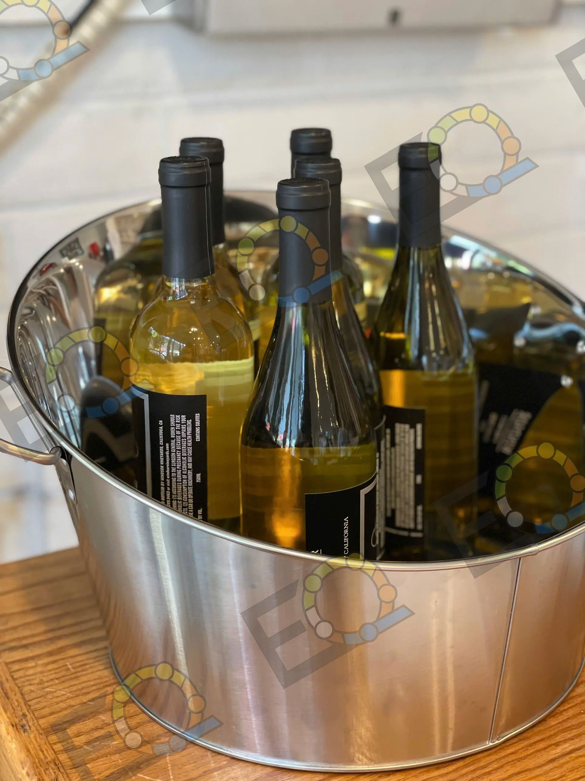 Bottles of white wine chilling in an ice bucket